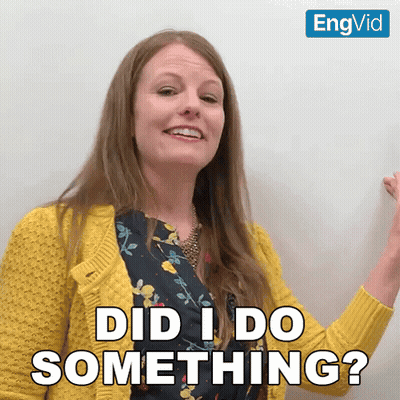 A Woman In A Yellow Sweater Is Smiling And Asking Did I Do Something GIF