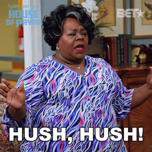 A Woman In A Zebra Print Shirt Says Hush GIF