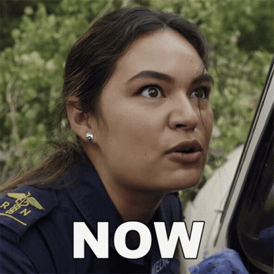 A Woman In An Ambulance Uniform Has The Word Now Written On Her Face GIF
