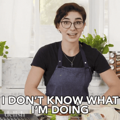 A Woman In An Apron Is Saying " I Don T Know What I 'M Doing " GIF