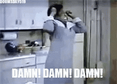 A Woman In An Apron Is Standing In A Kitchen With The Words `` Damn ! Damn ! Damn ! '' . GIF