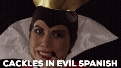 A Woman In An Evil Queen Costume With The Words " Cackle In Evil Spanish " Above Her GIF