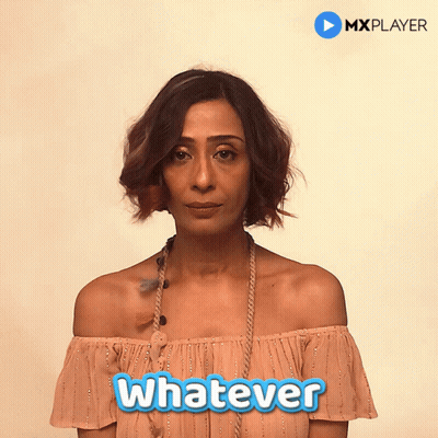 A Woman In An Off The Shoulder Top With The Word Whatever On It GIF