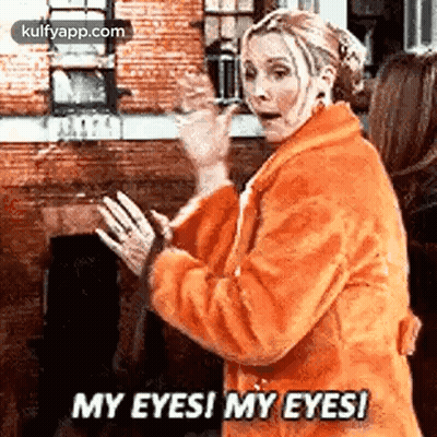 A Woman In An Orange Coat Is Saying `` My Eyes ! My Eyes ! '' . GIF