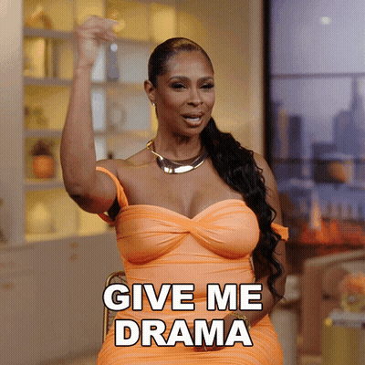 A Woman In An Orange Dress Is Asking For Drama GIF