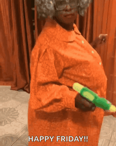 A Woman In An Orange Dress Is Holding A Green Water Gun And Says Happy Friday . GIF