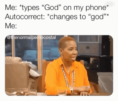 A Woman In An Orange Shirt Is Sitting At A Table Talking To Someone GIF