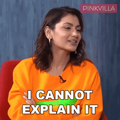 A Woman In An Orange Shirt Is Sitting In A Chair And Says I Cannot Explain It GIF