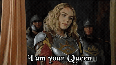 A Woman In Armor Says " I Am Your Queen " In Front Of A Group Of Men In Armor GIF