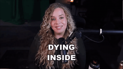 A Woman In Front Of A Microphone With The Words Dying Inside Above Her Head GIF