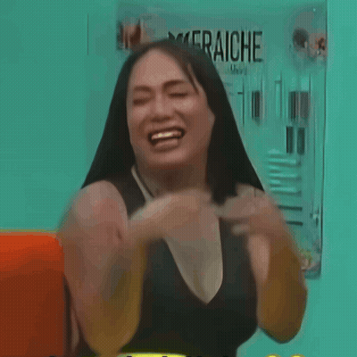 A Woman In Front Of A Sign That Says Fraiche On It GIF
