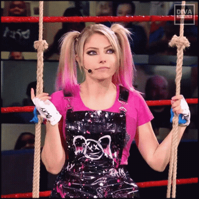 A Woman In Overalls Is Holding A Rope In Front Of A Diva Sign GIF
