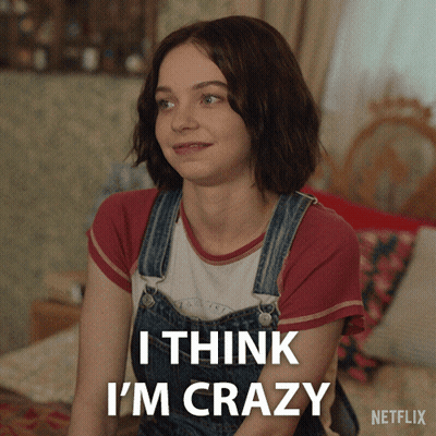 A Woman In Overalls Says I Think I 'M Crazy In A Netflix Advertisement GIF