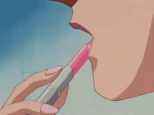 A Woman Is Applying Pink Lipstick To Her Lips In A Bathroom . GIF
