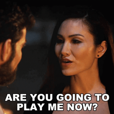 A Woman Is Asking A Man If He Is Going To Play Her GIF