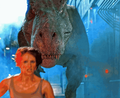A Woman Is Being Attacked By A Dinosaur In A Scene From A Movie GIF