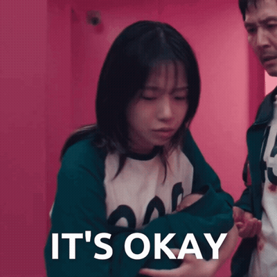 A Woman Is Being Held By A Man With The Words It 'S Okay Written On The Bottom GIF