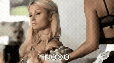 A Woman Is Being Held By Another Woman In A Room And Says Nooo . GIF