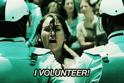 A Woman Is Being Held By Police Officers And Says " I Volunteer " GIF