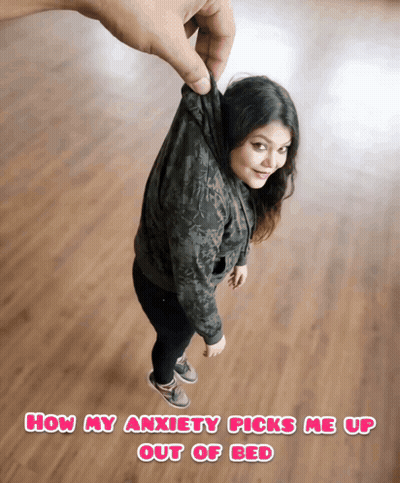 A Woman Is Being Held Up By A Hand With The Caption How My Anxiety Picks Me Up Out Of Bed Below Her GIF