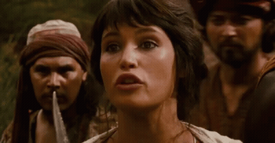A Woman Is Being Tied Up By A Man With A Rope Around Her Mouth . GIF