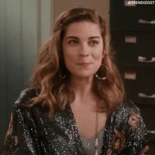 Woman Clapping In Room Wearing Black Dress And Hoop Earrings GIF