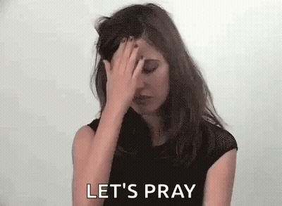 A Woman Is Covering Her Face With Her Hand And Says Let 'S Pray . GIF