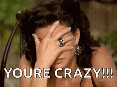 A Woman Is Covering Her Face With Her Hand And The Words `` You 'Re Crazy ! '' GIF