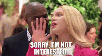A Woman Is Covering Her Face With Her Hand While A Man Says `` Sorry , I 'M Not Interested `` . GIF