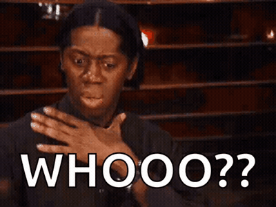 A Woman Is Covering Her Mouth With Her Hand And The Word Whooo Is Written On The Screen Behind Her GIF