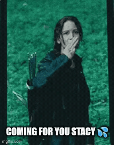 A Woman Is Covering Her Mouth With Her Hand While Holding A Bow And Arrow In A Field . GIF