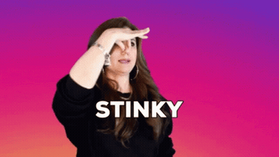 A Woman Is Covering Her Nose With Her Hand And The Word Stinky Is Above Her GIF