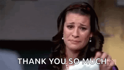 A Woman Is Crying And Holding A Piece Of Paper With The Words `` Thank You So Much '' Written On It . GIF