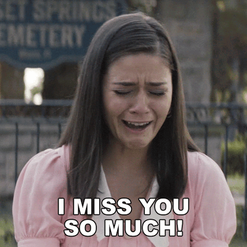 A Woman Is Crying In Front Of A Cemetery And Says " I Miss You So Much " GIF