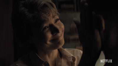 A Woman Is Crying In Front Of A Man With Netflix Written On The Bottom GIF