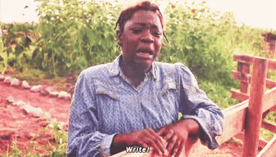 A Woman Is Crying In Front Of A Wooden Fence And Says " Writel " GIF