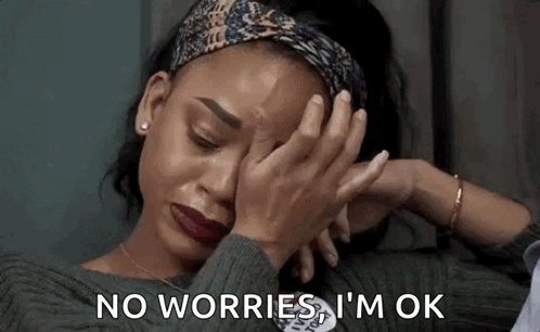 A Woman Is Crying While Covering Her Face With Her Hands And Says `` No Worries , I 'M Ok '' . GIF