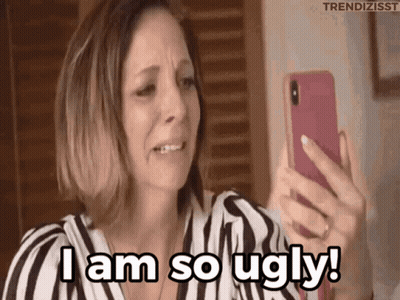A Woman Is Crying While Looking At Her Phone And Says I Am So Ugly . GIF