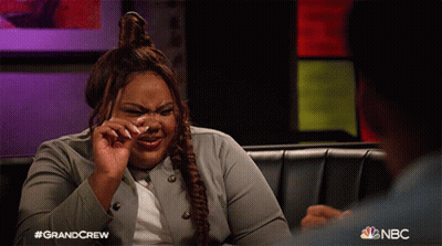 A Woman Is Crying While Sitting On A Couch With Nbc Written On The Bottom GIF