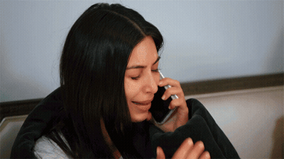A Woman Is Crying While Talking On A Cellphone GIF
