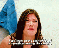 A Woman Is Crying While Wearing A Short Skirt And A Top Without Looking Like A Fat Pig .. GIF