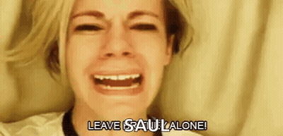 A Woman Is Crying With Her Mouth Open And The Words `` Leave Saul Alone '' Written Below Her . GIF