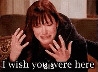 A Woman Is Crying With The Words `` I Wish You Were Here '' Written On The Bottom . GIF