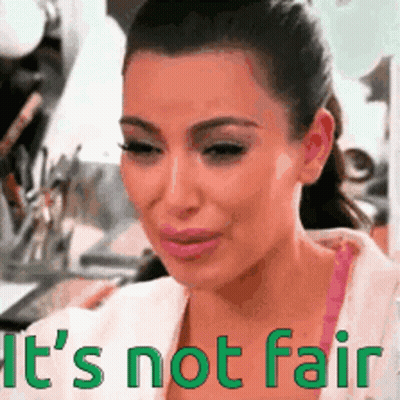 A Woman Is Crying With The Words " It 'S Not Fair " In Green Letters GIF