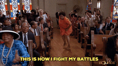 A Woman Is Dancing In A Church With The Words " This Is How I Fight My Battles " Below Her GIF