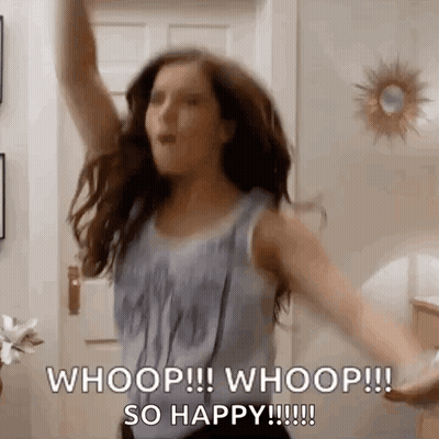 A Woman Is Dancing In A Room With Her Arms In The Air And Saying Whoop ! Whoop ! So Happy ! GIF