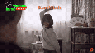 A Woman Is Dancing In A Room With Kaomiah Written On The Wall GIF