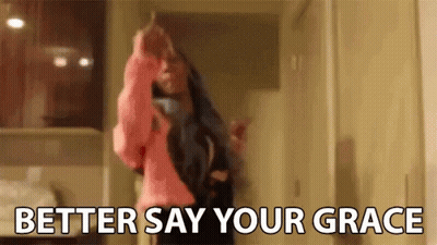 A Woman Is Dancing In A Room With The Words `` Better Say Your Grace '' Written On The Bottom . GIF