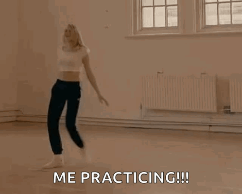 A Woman Is Dancing In A Room With The Words `` Me Practicing '' Written On It . GIF