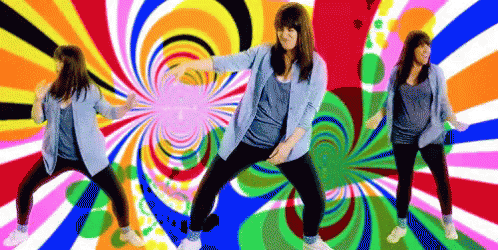 A Woman Is Dancing In Front Of A Colorful Swirl Background GIF